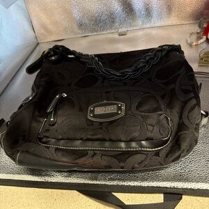 Strata Black Shoulder Bag with logo on the front.